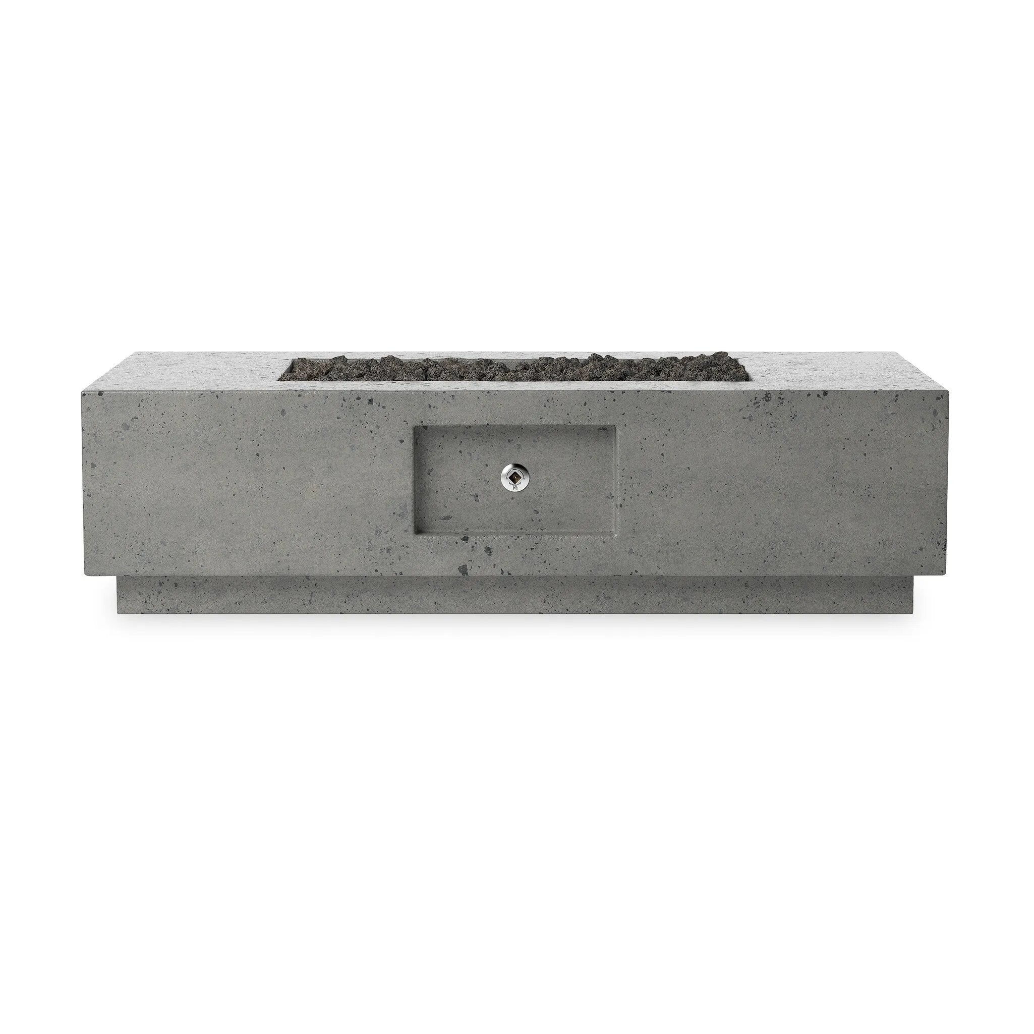 This outdoor fire table is a welcoming centerpiece designed for gathering. Made from glass-reinforced concrete, each piece is naturally finished with deep tones of pewter and dark grey. The monolithic shape is completed with lavastones in the center, bringing together a bold, monochromatic look. Amethyst Home provides interior design, new home construction design consulting, vintage area rugs, and lighting in the Newport Beach metro area.