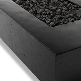 This outdoor fire table is a welcoming centerpiece designed for gathering. Made from glass-reinforced concrete, each piece is naturally finished with deep tones of charcoal. The monolithic shape is completed with lavastones in the center, bringing together a bold, monochromatic look. Amethyst Home provides interior design, new home construction design consulting, vintage area rugs, and lighting in the Alpharetta metro area.