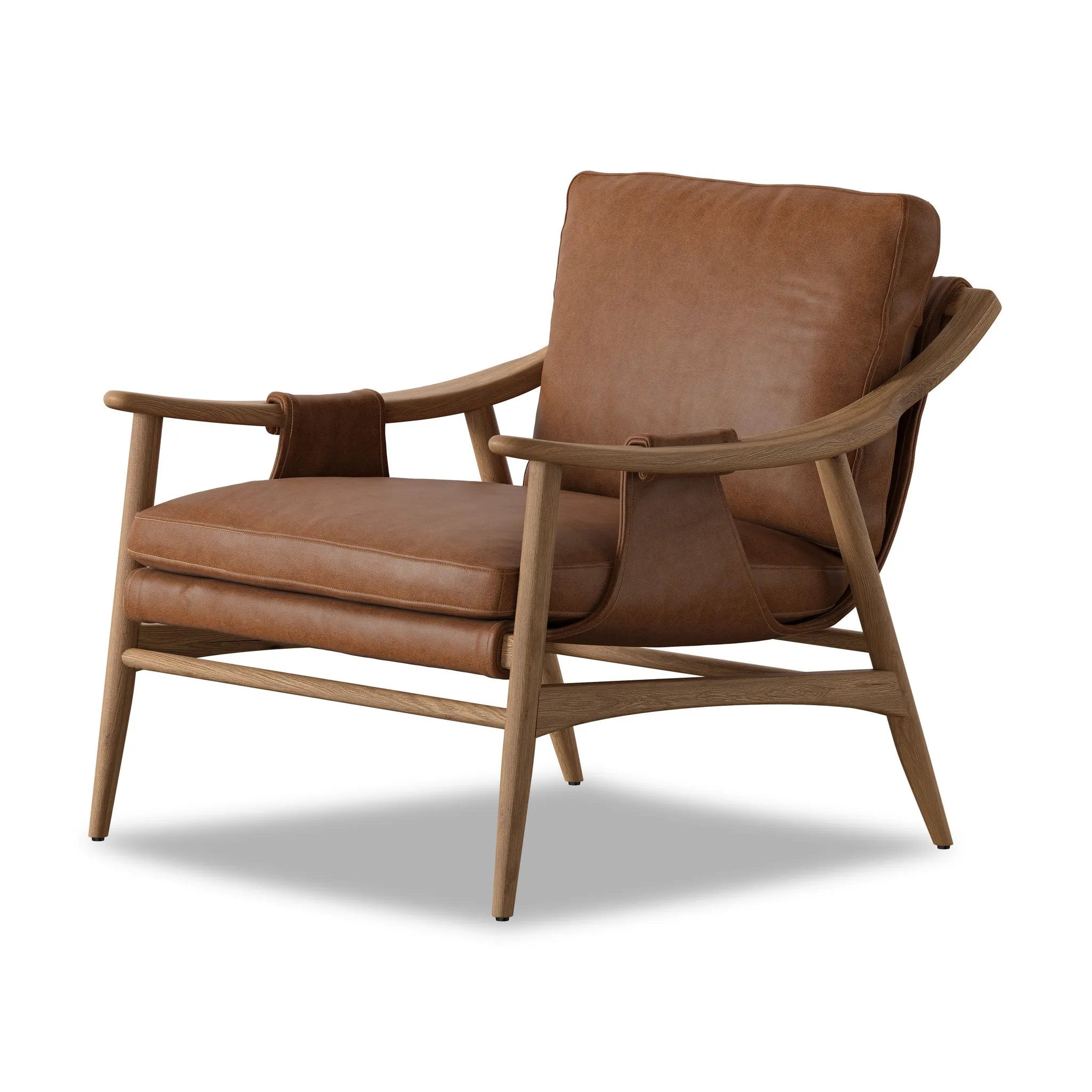 Made with thick-cut top-grain leather with a plump, pronounced grain, a sling-style chair features feather- and fiber-blend cushions for comfort, with clean boxing detailing. Between tapered oak legs, stretchers shape a slight arch, for an intriguing design detail Amethyst Home provides interior design, new home construction design consulting, vintage area rugs, and lighting in the Tampa metro area.