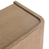 Featuring Kiran Sandy Oak Veneer Nightstand by Four Hands at Amethyst Home. Bring storage to your bedside with a monochromatic nightstand of sandy oak and painted linen, with split-circle iron hardware. A spacious interior features removable shelving to custom suit your needs. Overall Dimensions: 30.00"w x 20.00"d x 25.00"h. Amethyst Home provides interior design, new home construction design consulting, vintage area rugs, and lighting in the Des Moines metro area.