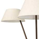 A tripod-base floor lamp, provides light in every direction. Made with slim, sturdy iron in a rubbed bronze finish and topped with linen shades for a soft glow Amethyst Home provides interior design, new home construction design consulting, vintage area rugs, and lighting in the Monterey metro area.