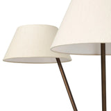 A tripod-base floor lamp, provides light in every direction. Made with slim, sturdy iron in a rubbed bronze finish and topped with linen shades for a soft glow Amethyst Home provides interior design, new home construction design consulting, vintage area rugs, and lighting in the Monterey metro area.