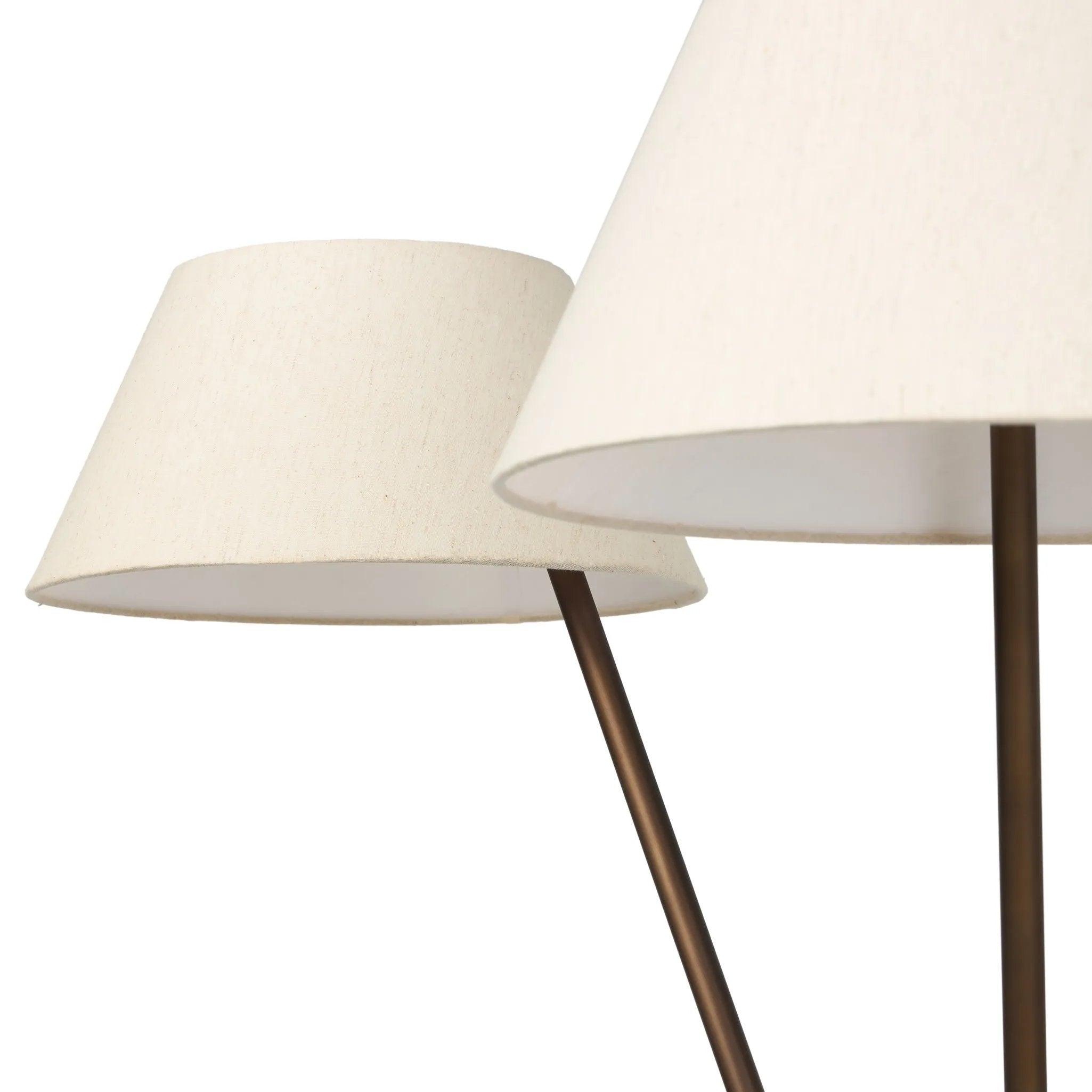 A tripod-base floor lamp, provides light in every direction. Made with slim, sturdy iron in a rubbed bronze finish and topped with linen shades for a soft glow Amethyst Home provides interior design, new home construction design consulting, vintage area rugs, and lighting in the Monterey metro area.
