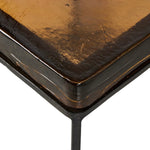 An airy, angular base of charcoal-burnished iron supports a squared tabletop of amber cast glass, perfectly sized to keep your drink or book within reach. Styles well alone or paired in multiples.Collection: Marlo Amethyst Home provides interior design, new home construction design consulting, vintage area rugs, and lighting in the Miami metro area.