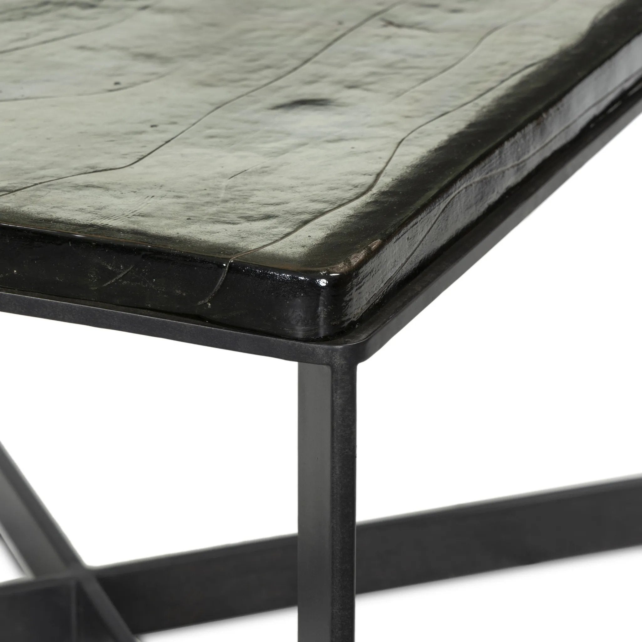 Featuring Lennie Clear Cast Glass Cast Glass Bunching Table by Four Hands at Amethyst Home. An airy, angular base of charcoal-burnished iron supports a squared tabletop of amber cast glass. Styles well alone or paired in multiples.Overall Dimensions: 25.00"w x 25.00"d x 15.75"hWeight : 120.06 lbsMaterials: Cast Glass, Iron. Amethyst Home provides interior design, new home construction design consulting, vintage area rugs, and lighting in the Laguna Beach metro area.