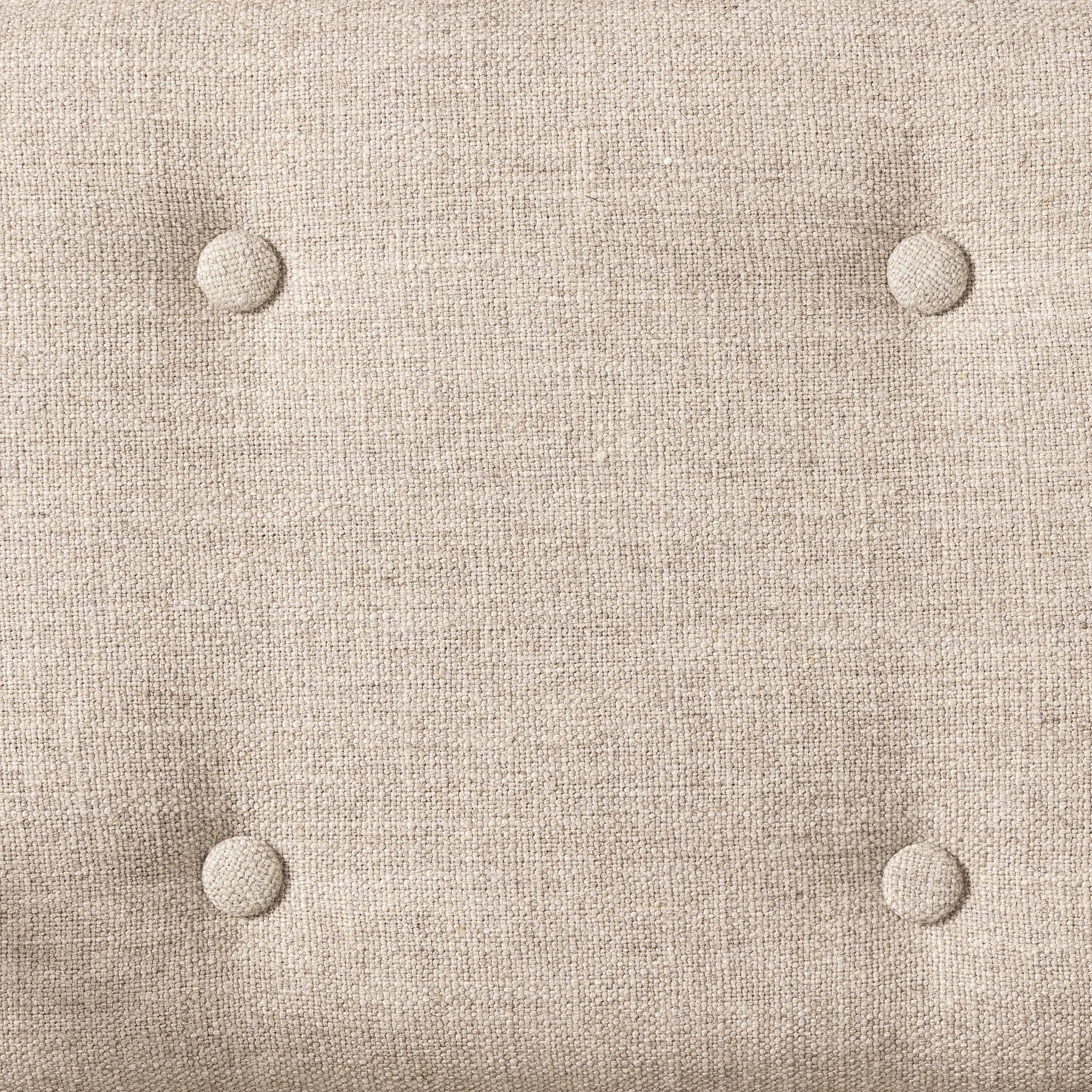 Inspired by a vintage safari-style frame, this dining chair is defined by the fluid strap arms. Semi-attached cushions in taupe performance fabric, finished with button tufting details. Framed out by warm parawood. Amethyst Home provides interior design, new home construction design consulting, vintage area rugs, and lighting in the Boston metro area.