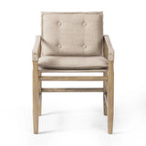 Inspired by a vintage safari-style frame, this dining chair is defined by the fluid strap arms. Semi-attached cushions in taupe performance fabric, finished with button tufting details. Framed out by warm parawood. Amethyst Home provides interior design, new home construction design consulting, vintage area rugs, and lighting in the Park City metro area.