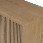 Made from rustic-finished oak with a plinth-style base, clean angles and linear reeding define this midcentury-spirited sideboard. Fully finished interior for a beautiful look inside and out. Designed in partnership with longtime Four Hands collaborator Thomas Bina and Brazilian designer Ronald Sasson Amethyst Home provides interior design, new home construction design consulting, vintage area rugs, and lighting in the Austin metro area.