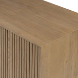 Made from rustic-finished oak with a plinth-style base, clean angles and linear reeding define this midcentury-spirited sideboard. Fully finished interior for a beautiful look inside and out. Designed in partnership with longtime Four Hands collaborator Thomas Bina and Brazilian designer Ronald Sasson Amethyst Home provides interior design, new home construction design consulting, vintage area rugs, and lighting in the Austin metro area.