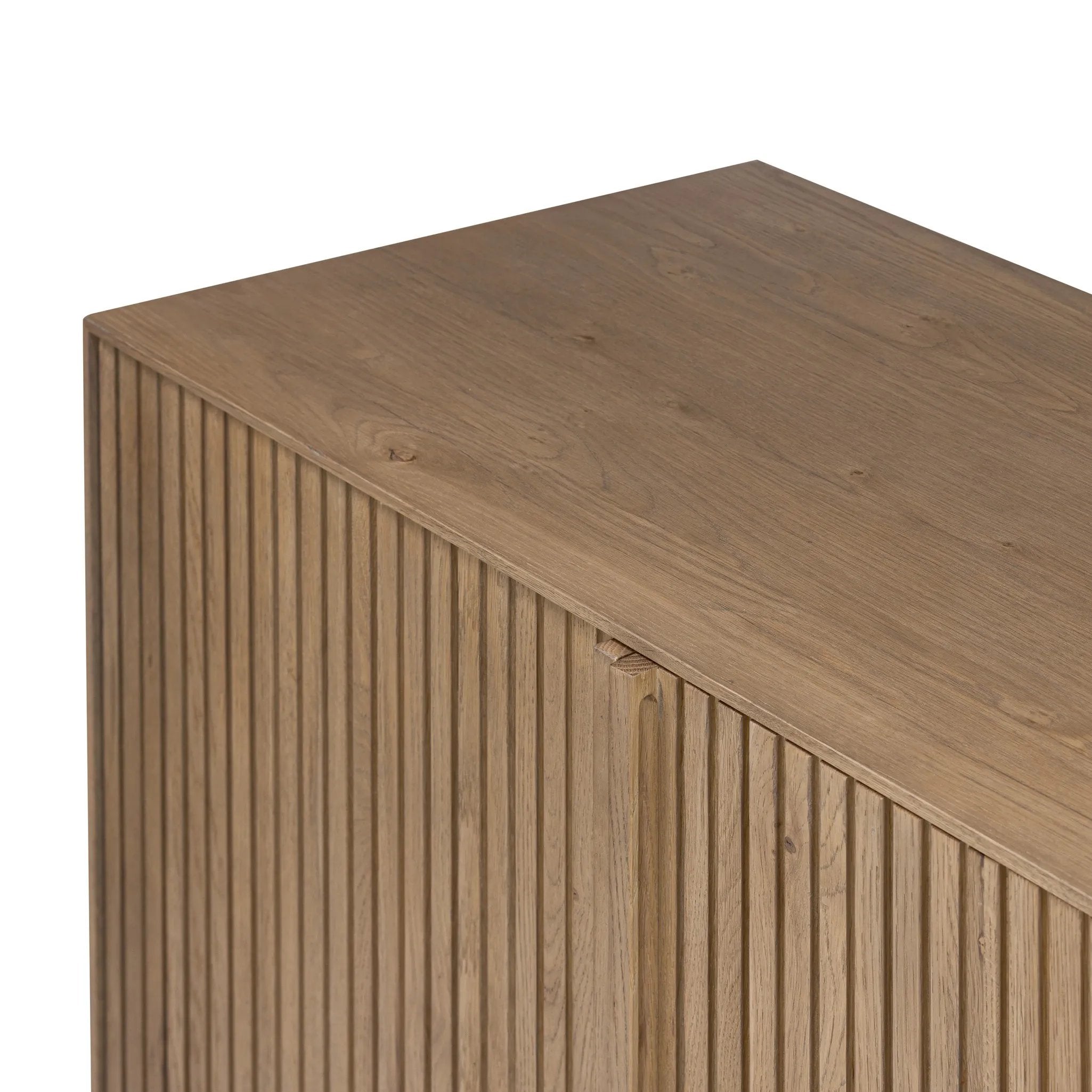 Made from rustic-finished oak with a plinth-style base, clean angles and linear reeding define this midcentury-spirited sideboard. Fully finished interior for a beautiful look inside and out. Designed in partnership with longtime Four Hands collaborator Thomas Bina and Brazilian designer Ronald Sasson Amethyst Home provides interior design, new home construction design consulting, vintage area rugs, and lighting in the Portland metro area.