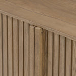 Made from rustic-finished oak with a plinth-style base, clean angles and linear reeding define this midcentury-spirited sideboard. Fully finished interior for a beautiful look inside and out. Designed in partnership with longtime Four Hands collaborator Thomas Bina and Brazilian designer Ronald Sasson Amethyst Home provides interior design, new home construction design consulting, vintage area rugs, and lighting in the Tampa metro area.