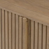 Made from rustic-finished oak with a plinth-style base, clean angles and linear reeding define this midcentury-spirited sideboard. Fully finished interior for a beautiful look inside and out. Designed in partnership with longtime Four Hands collaborator Thomas Bina and Brazilian designer Ronald Sasson Amethyst Home provides interior design, new home construction design consulting, vintage area rugs, and lighting in the Tampa metro area.