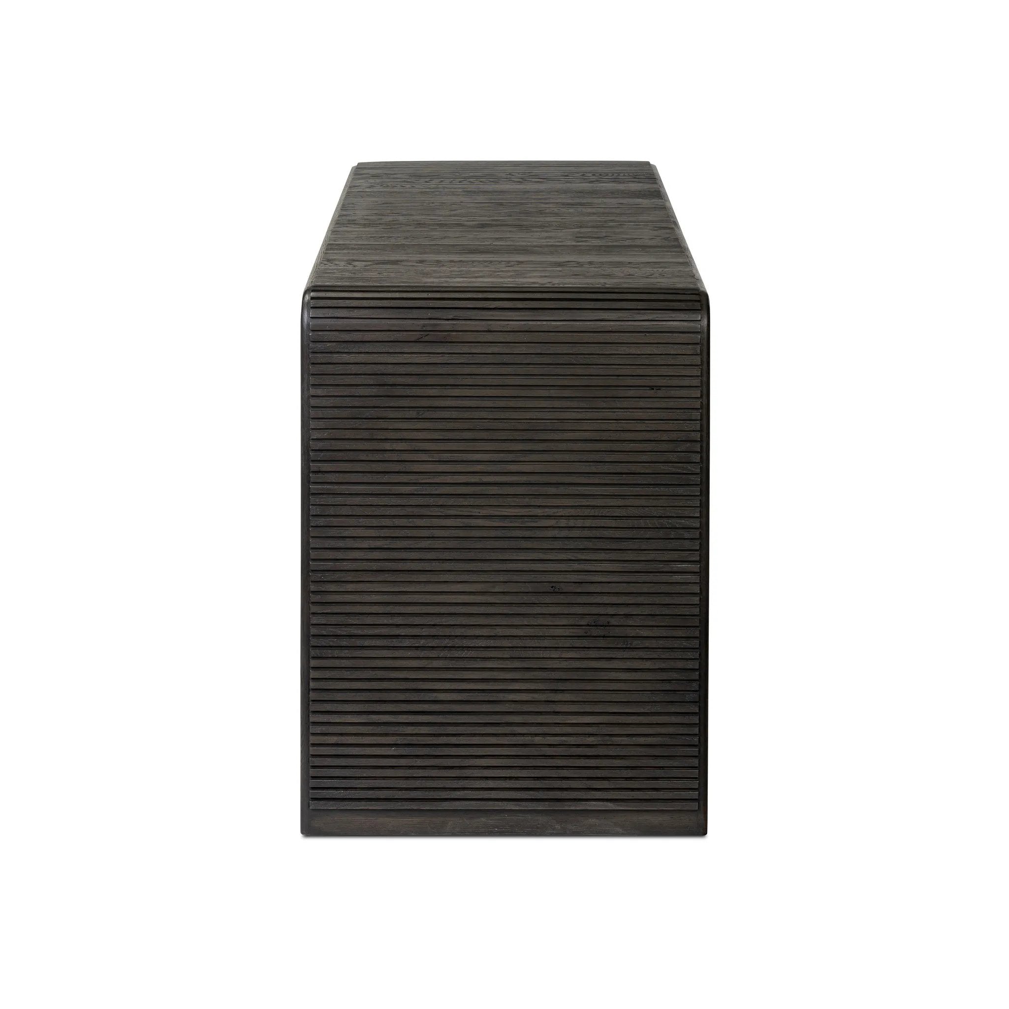 Featuring Leo Smoked Black Console Table by Four Hands at Amethyst Home. Smoked black oak shapes an elongated console table, rich with reeding. Subtly rounded edges reflect Brazilian midcentury inspiration behind this crafted minimalist piece. Designed in partnership with longtime Four Hands collaborator Thomas Bina and designer Ronald Sasson.Overall Dime. Amethyst Home provides interior design, new home construction design consulting, vintage area rugs, and lighting in the Kansas City metro area.