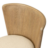 The barrel back dining chair, refreshed. Light oak shapes an armless frame and curved rear legs that almost appear to flow into the seat back. A comfy seat is upholstered in high-performance fabric, while reeding details on the back create a sense of perception play. Amethyst Home provides interior design, new home construction design consulting, vintage area rugs, and lighting in the Winter Garden metro area.
