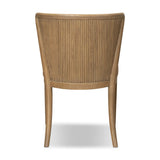 The barrel back dining chair, refreshed. Light oak shapes an armless frame and curved rear legs that almost appear to flow into the seat back. A comfy seat is upholstered in chestnut top-grain leather, while reeding details on the back create a sense of perception play. Amethyst Home provides interior design, new home construction design consulting, vintage area rugs, and lighting in the Dallas metro area.