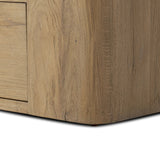 A clean, wide storage style crafted of aged natural oak brings a Brutalist look to any room. Plenty of open shelving offers endless options for favorite books and treasures, while a lower push-latch drawer finishes the look Amethyst Home provides interior design, new home construction design consulting, vintage area rugs, and lighting in the Boston metro area.