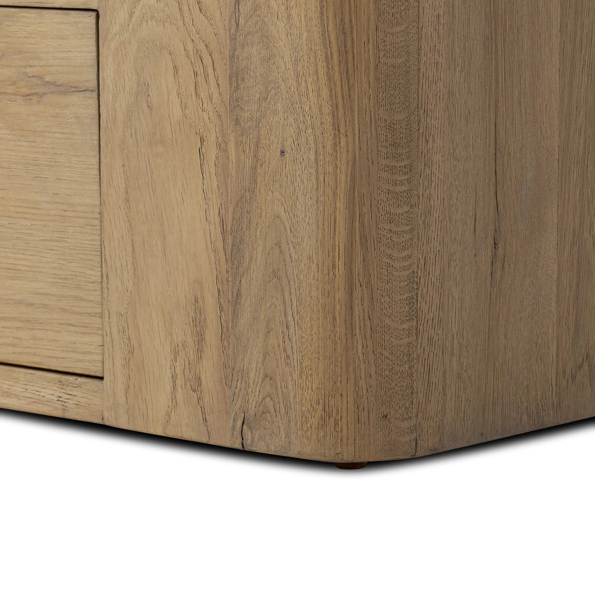 A clean, wide storage style crafted of aged natural oak brings a Brutalist look to any room. Plenty of open shelving offers endless options for favorite books and treasures, while a lower push-latch drawer finishes the look Amethyst Home provides interior design, new home construction design consulting, vintage area rugs, and lighting in the Boston metro area.