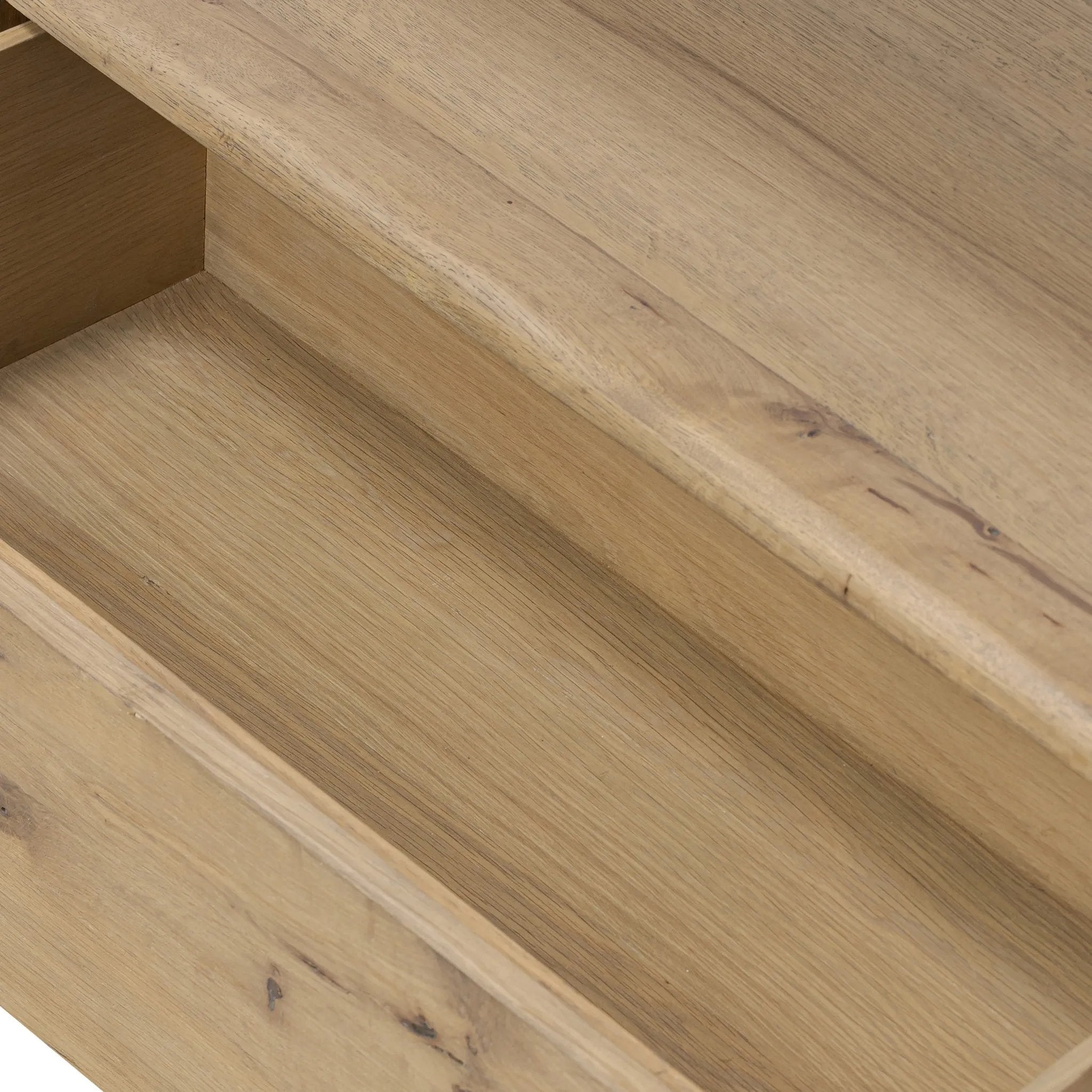 A clean, wide storage style crafted of aged natural oak brings a Brutalist look to any room. Plenty of open shelving offers endless options for favorite books and treasures, while a lower push-latch drawer finishes the look Amethyst Home provides interior design, new home construction design consulting, vintage area rugs, and lighting in the Winter Garden metro area.