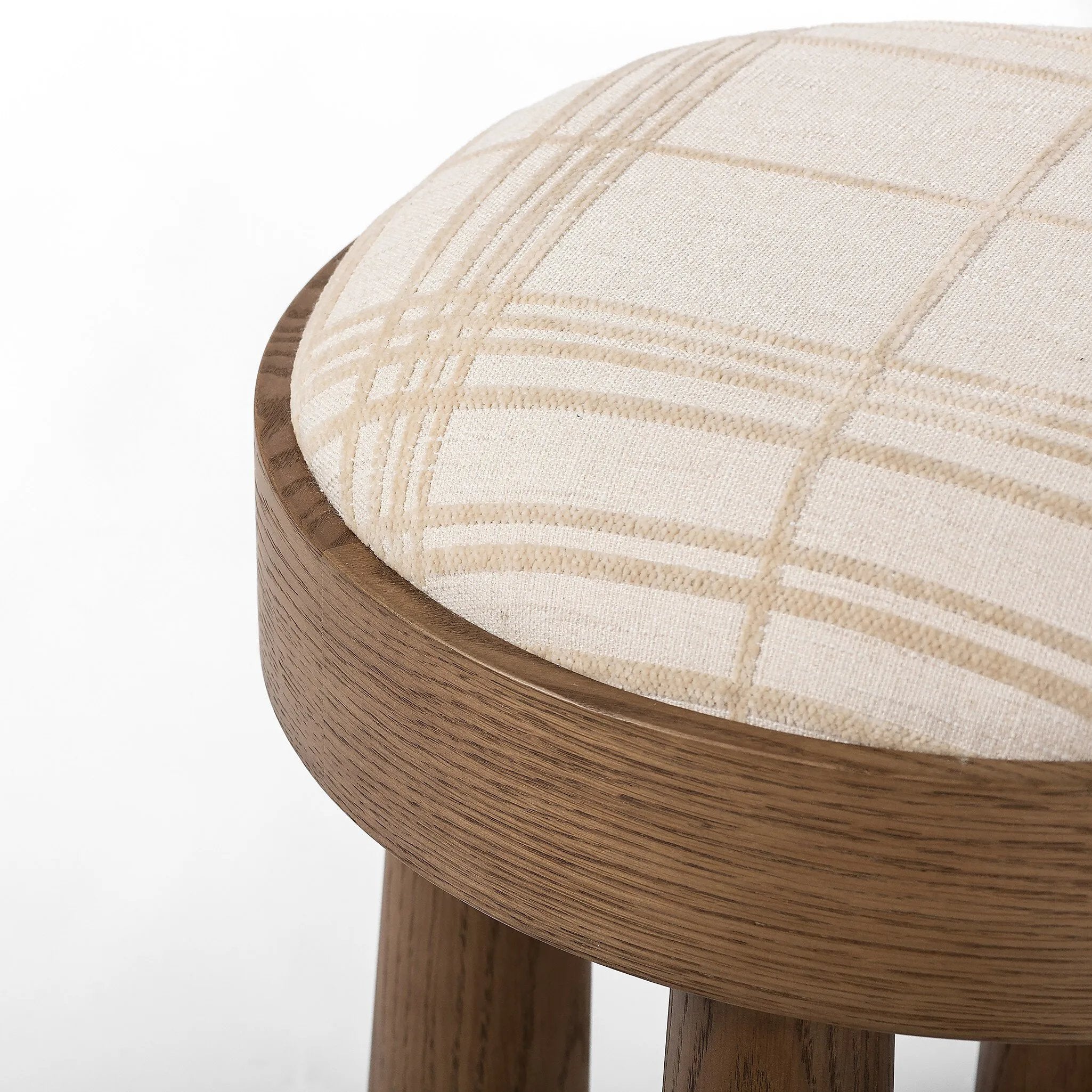 A simple, charming stool with natural oak wood veneer finish and a seat upholstered in a traditional ivory fabric with a classic box pattern. Tapered legs add subtle character.As lovers of clean design at Amethyst, we love the optimistic inspired Louise Accent Stool - Sheffield Ivory. Amethyst Home provides interior design, new home construction design consulting, vintage area rugs, and lighting in the Des Moines metro area.