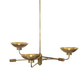 Artfully diffused lighting inspired by 1920s glam. Three glowing discs nestle within curved brass reflectors, creating a warm, expansive ambiance. Reeding detail on the socket and stem add texture, while a hand-burnt brass finish ensures each piece ages uniquely, developing character over time Amethyst Home provides interior design, new home construction design consulting, vintage area rugs, and lighting in the Charlotte metro area.