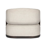 A playful outdoor chair silhouette with a 360 swivel base. The yolk-shaped back is framed by sleek metal accents, adding visual contrast to the exploded boucle upholstery on the thick seat cushion and curved back. Cover or store inside during inclement weather and when not in use. Amethyst Home provides interior design, new home construction design consulting, vintage area rugs, and lighting in the Calabasas metro area.
