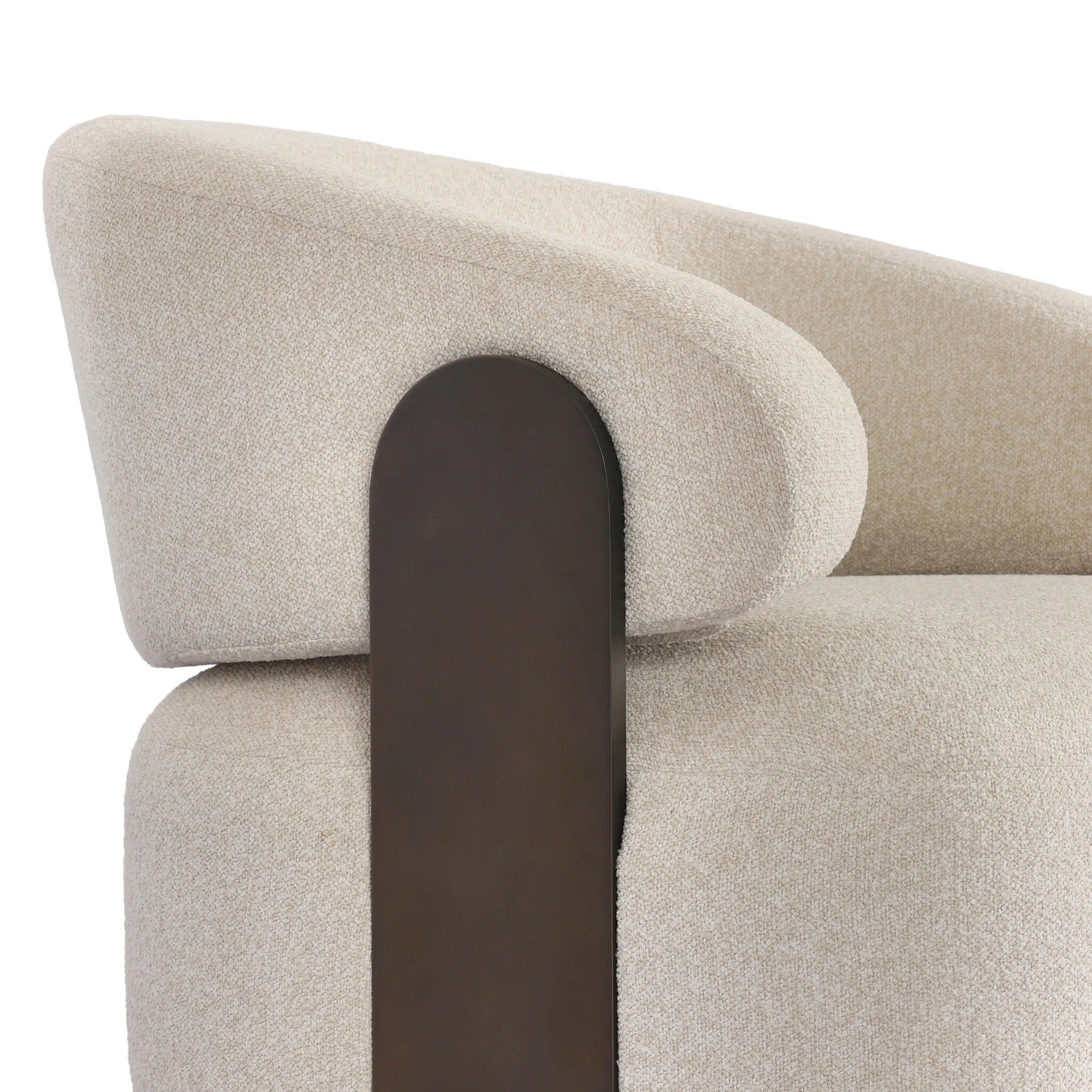 A playful outdoor chair silhouette with a 360 swivel base. The yolk-shaped back is framed by sleek metal accents, adding visual contrast to the exploded boucle upholstery on the thick seat cushion and curved back. Cover or store inside during inclement weather and when not in use. Amethyst Home provides interior design, new home construction design consulting, vintage area rugs, and lighting in the Dallas metro area.