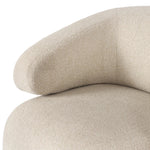 A playful outdoor chair silhouette with a 360 swivel base. The yolk-shaped back is framed by sleek metal accents, adding visual contrast to the exploded boucle upholstery on the thick seat cushion and curved back. Cover or store inside during inclement weather and when not in use. Amethyst Home provides interior design, new home construction design consulting, vintage area rugs, and lighting in the Washington metro area.