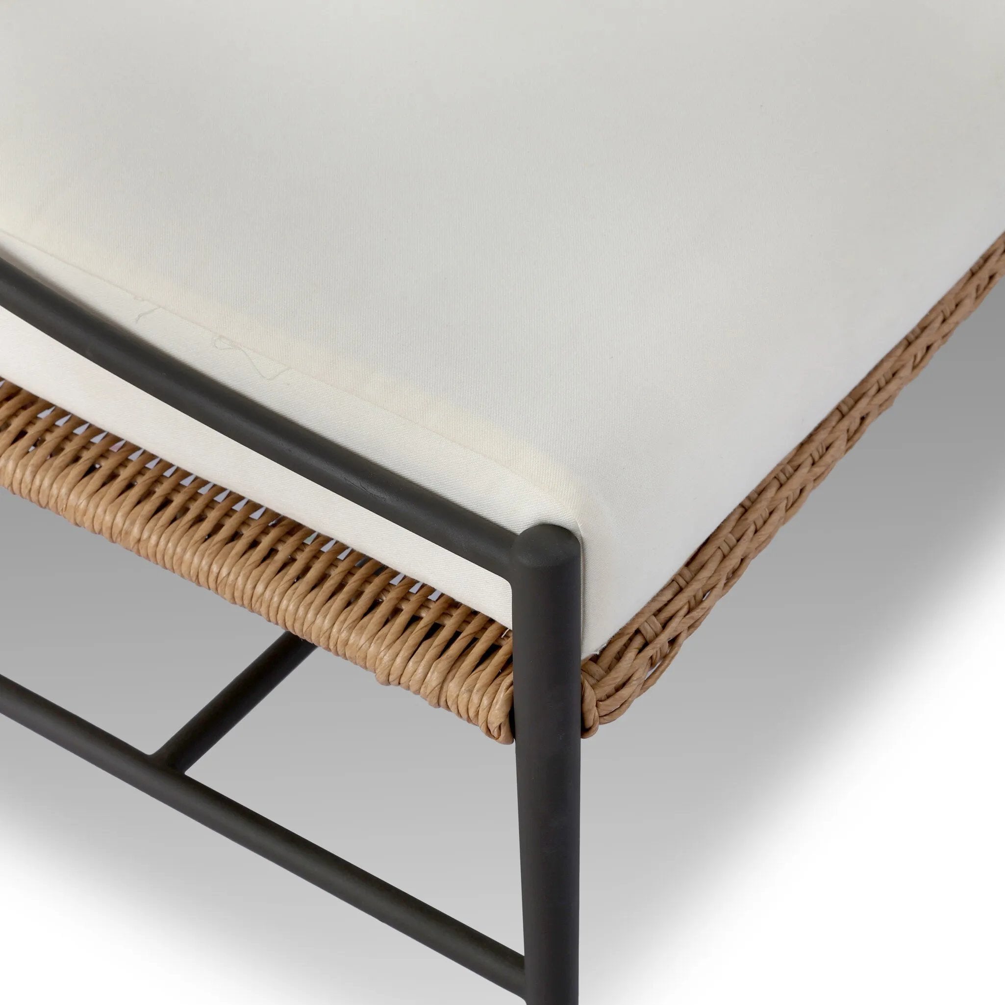 A modern take on traditional weaving patterns centers this outdoor dining bench. Subtly arched metal framing details and a relaxed knife-edge seat cushion invite softness. Cover or store inside during inclement weather and when not in use. A design collaboration by Amber Lewis and Four Hands. Amethyst Home provides interior design, new home construction design consulting, vintage area rugs, and lighting in the Washington metro area.