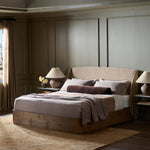 Featuring Maeve Laken Taupe Bed by Four Hands at Amethyst Home. Clean lines meet contoured curves for a timeless bedroom look. A petal-shaped shelter overlaps side rails for a unique,  comforting silhouette. Fully upholstered in a versatile taupe that complements a wide range of color palettes, all grounded by a rich oak base. Overall Dimensions: Queen:
70.50". Amethyst Home provides interior design, new home construction design consulting, vintage area rugs, and lighting in the Austin metro area.