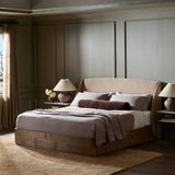 Featuring Maeve Laken Taupe Bed by Four Hands at Amethyst Home. Clean lines meet contoured curves for a timeless bedroom look. A petal-shaped shelter overlaps side rails for a unique,  comforting silhouette. Fully upholstered in a versatile taupe that complements a wide range of color palettes, all grounded by a rich oak base. Overall Dimensions: Queen:
70.50". Amethyst Home provides interior design, new home construction design consulting, vintage area rugs, and lighting in the Austin metro area.