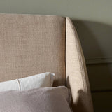 Featuring Maeve Laken Taupe Bed by Four Hands at Amethyst Home. Clean lines meet contoured curves for a timeless bedroom look. A petal-shaped shelter overlaps side rails for a unique,  comforting silhouette. Fully upholstered in a versatile taupe that complements a wide range of color palettes, all grounded by a rich oak base. Overall Dimensions: Queen:
70.50. Amethyst Home provides interior design, new home construction design consulting, vintage area rugs, and lighting in the Seattle metro area.