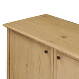 A cleanly shaped sideboard is crafted from aged smoked oak, highlighting the wood's natural grain throughout. Roomy cabinets offer plenty of storage, and the slim, tapered legs give the piece a subtle lift, creating a light but grounded look. Finished with petite bronze knobs. Amethyst Home provides interior design, new home construction design consulting, vintage area rugs, and lighting in the Austin metro area.