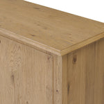 A cleanly shaped sideboard is crafted from aged smoked oak, highlighting the wood's natural grain throughout. Roomy cabinets offer plenty of storage, and the slim, tapered legs give the piece a subtle lift, creating a light but grounded look. Finished with petite bronze knobs. Amethyst Home provides interior design, new home construction design consulting, vintage area rugs, and lighting in the Monterey metro area.