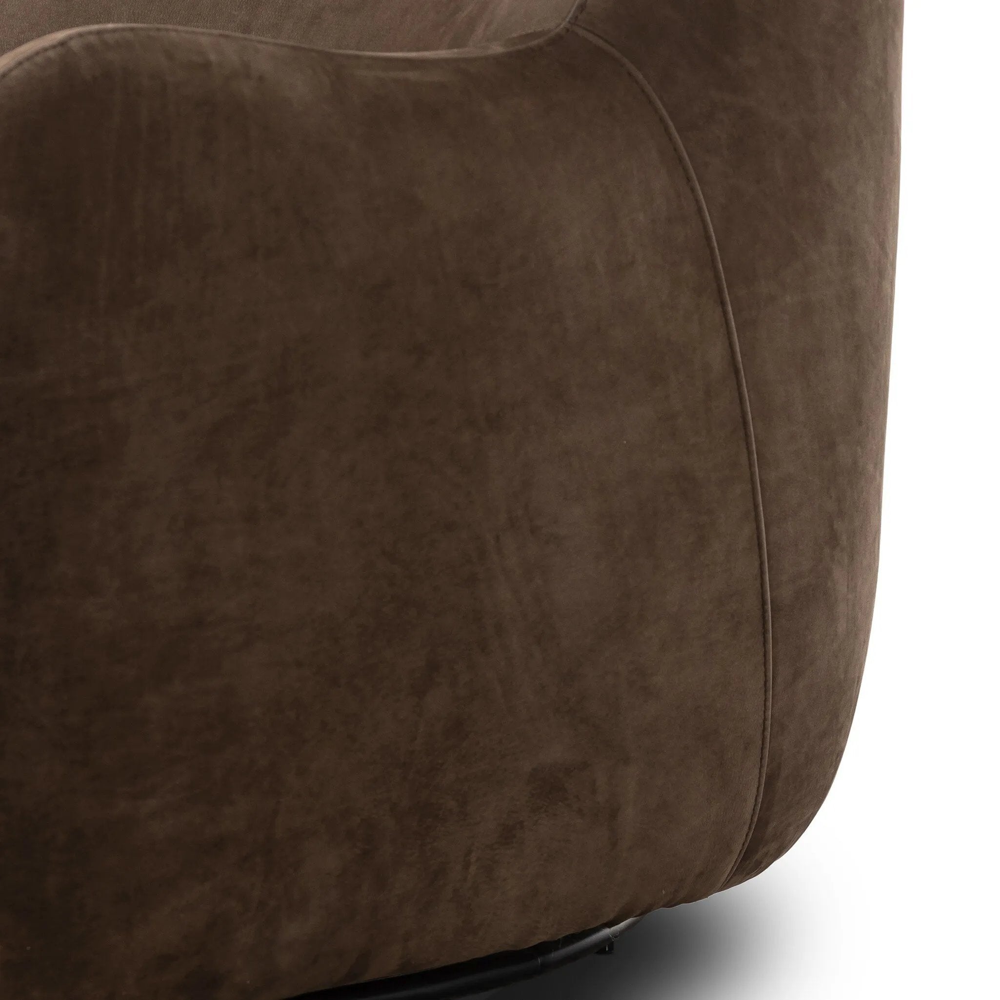 Modern wingback with a twist of barrel back design, this enveloping swivel chair comes with velvety upholstery in a deep brow