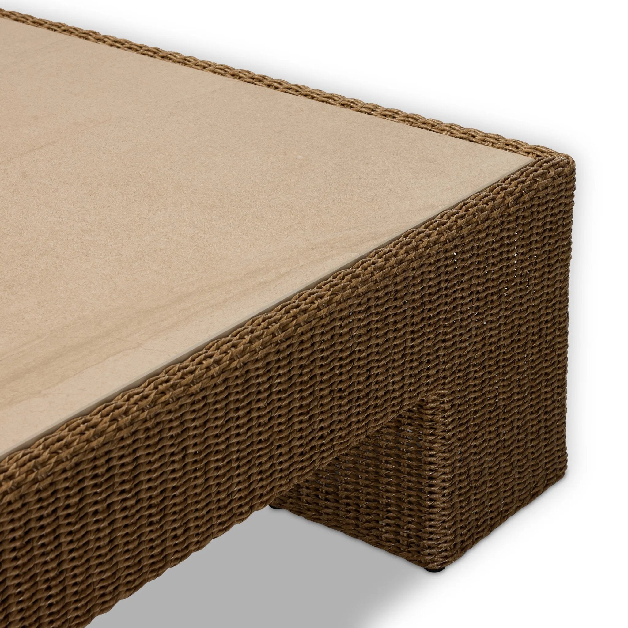 A fully woven outdoor coffee table, inspired by the classic Parsons shape. The engineered stone top is inset for a seamless blend of materials, bringing subtle tonal variation for added visual intrigue. Cover or store indoors when not in use or during inclement weather. Amethyst Home provides interior design, new home construction design consulting, vintage area rugs, and lighting in the Winter Garden metro area.