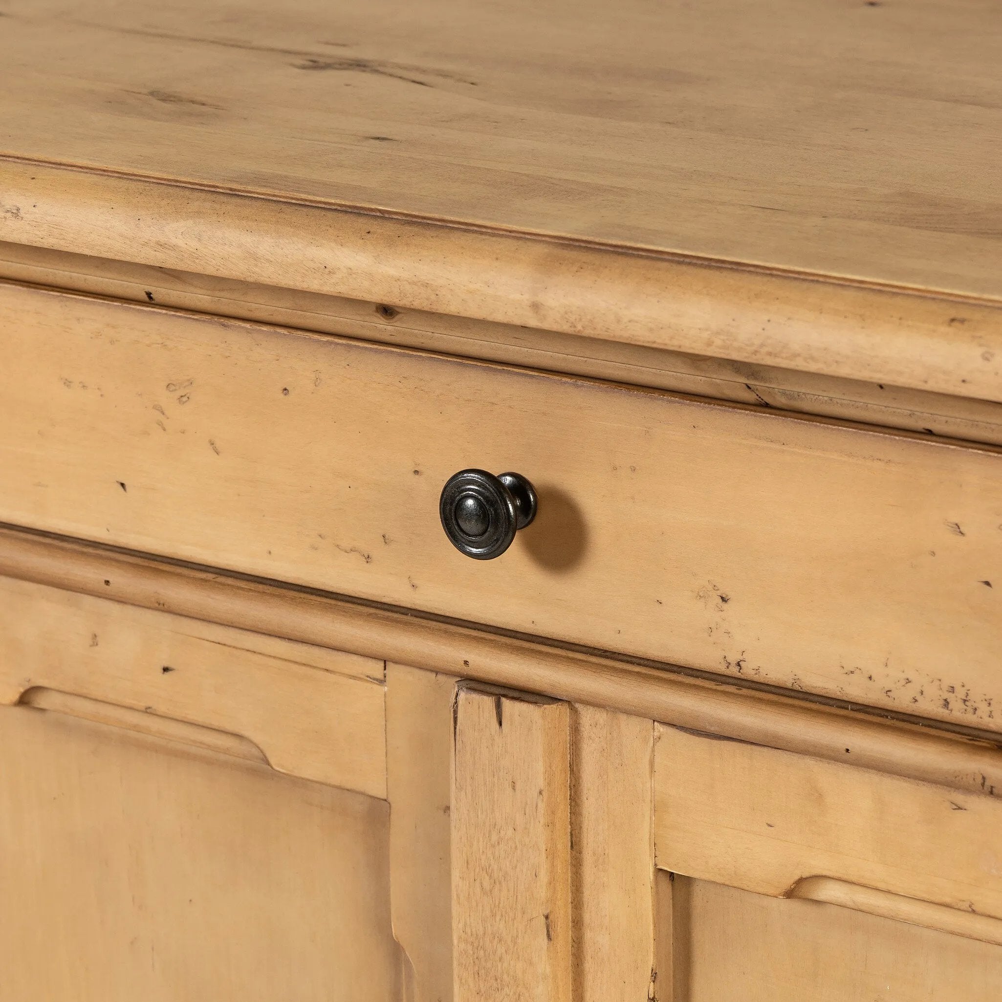 Inspired by European antiques, this solid pine sideboard features classic molding and detailing with distressed copper hardware for an authentic heirloom look and feel. Grand in scale with plenty of interior storage including three top drawers. Rear cutouts for cord management Amethyst Home provides interior design, new home construction design consulting, vintage area rugs, and lighting in the Charlotte metro area.