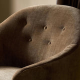 A traditional shape with modern styling, turned wooden legs complement the soft curves of this lounge-worthy chair. A chenill