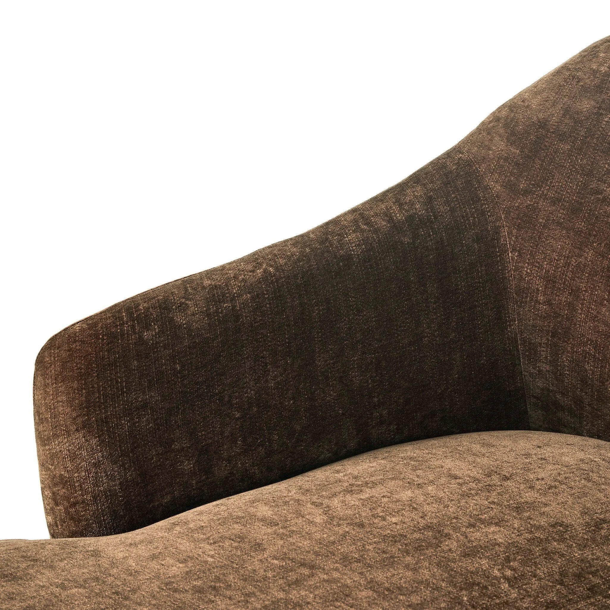 A traditional shape with modern styling, turned wooden legs complement the soft curves of this lounge-worthy chair. A chenill