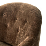 A traditional shape with modern styling, turned wooden legs complement the soft curves of this lounge-worthy chair. A chenill