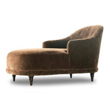 A traditional shape with modern styling, turned wooden legs complement the soft curves of this lounge-worthy chair. A chenill