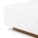 A white Carrara marble slab, rich with veining and movement. Supported by a wooden plinth, marble takes the spotlight in a design that's simple and sophisticated at once.Collection: Hughe Amethyst Home provides interior design, new home construction design consulting, vintage area rugs, and lighting in the Charlotte metro area.