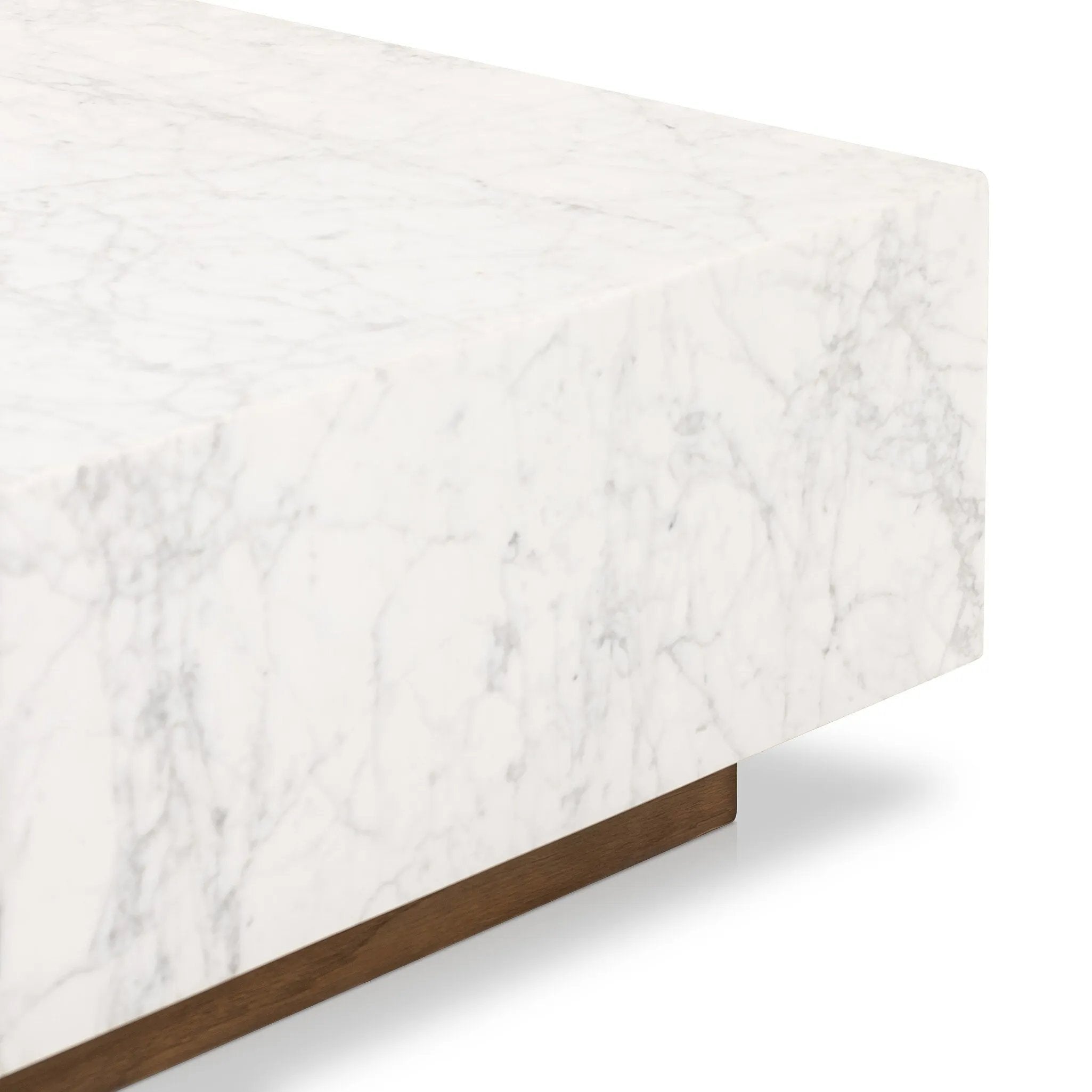 A white Carrara marble slab, rich with veining and movement. Supported by a wooden plinth, marble takes the spotlight in a design that's simple and sophisticated at once.Collection: Hughe Amethyst Home provides interior design, new home construction design consulting, vintage area rugs, and lighting in the Tampa metro area.