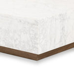 A white Carrara marble slab, rich with veining and movement. Supported by a wooden plinth, marble takes the spotlight in a design that's simple and sophisticated at once.Collection: Hughe Amethyst Home provides interior design, new home construction design consulting, vintage area rugs, and lighting in the Winter Garden metro area.