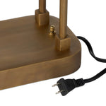 A library task light brings focused illumination to your workspace, nightstand or end table. Crafted from brass with an aged antique finish, the lamp has a rotary switch on the base and double post arms to hold the metal shade in place Amethyst Home provides interior design, new home construction design consulting, vintage area rugs, and lighting in the Newport Beach metro area.