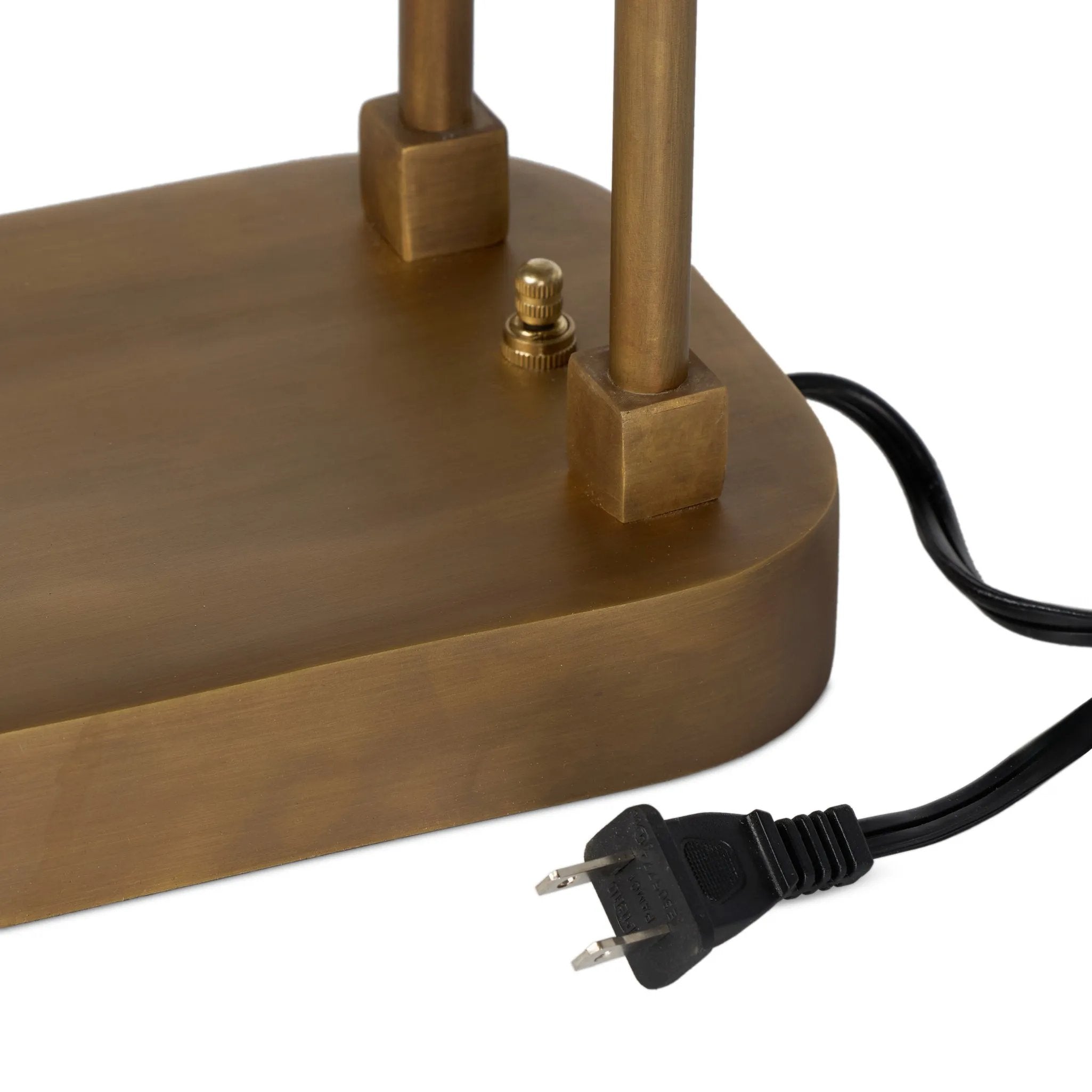 A library task light brings focused illumination to your workspace, nightstand or end table. Crafted from brass with an aged antique finish, the lamp has a rotary switch on the base and double post arms to hold the metal shade in place Amethyst Home provides interior design, new home construction design consulting, vintage area rugs, and lighting in the Newport Beach metro area.