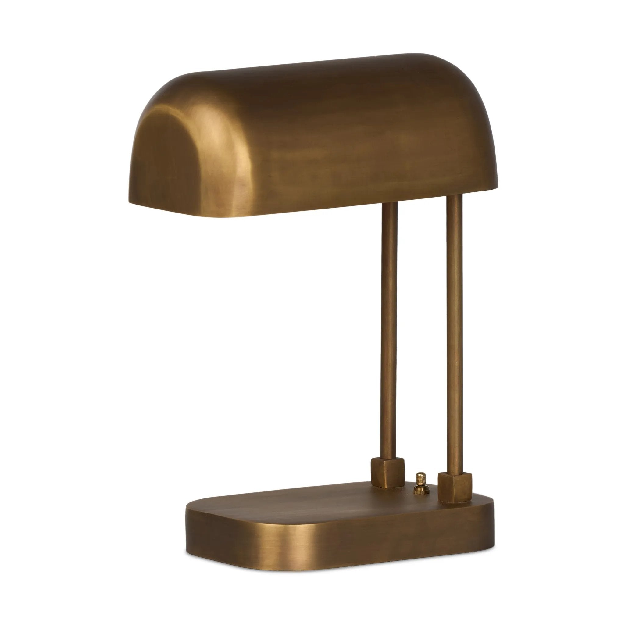 A library task light brings focused illumination to your workspace, nightstand or end table. Crafted from brass with an aged antique finish, the lamp has a rotary switch on the base and double post arms to hold the metal shade in place Amethyst Home provides interior design, new home construction design consulting, vintage area rugs, and lighting in the Washington metro area.