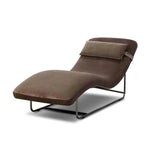 Contoured for comfort, this minimalist chaise is fixed with ideal ergonomics so you can simply sit back and unwind. Inspired by 1960s European design, the chaise blends a utilitarian aesthetic with high-quality tufting, stainless-steel framing, and smooth upholstery. The adjustable headrest is secured by a metal closure and magnetic strip. Amethyst Home provides interior design, new home construction design consulting, vintage area rugs, and lighting in the Alpharetta metro area.