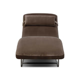 Contoured for comfort, this minimalist chaise is fixed with ideal ergonomics so you can simply sit back and unwind. Inspired by 1960s European design, the chaise blends a utilitarian aesthetic with high-quality tufting, stainless-steel framing, and smooth upholstery. The adjustable headrest is secured by a metal closure and magnetic strip. Amethyst Home provides interior design, new home construction design consulting, vintage area rugs, and lighting in the Houston metro area.