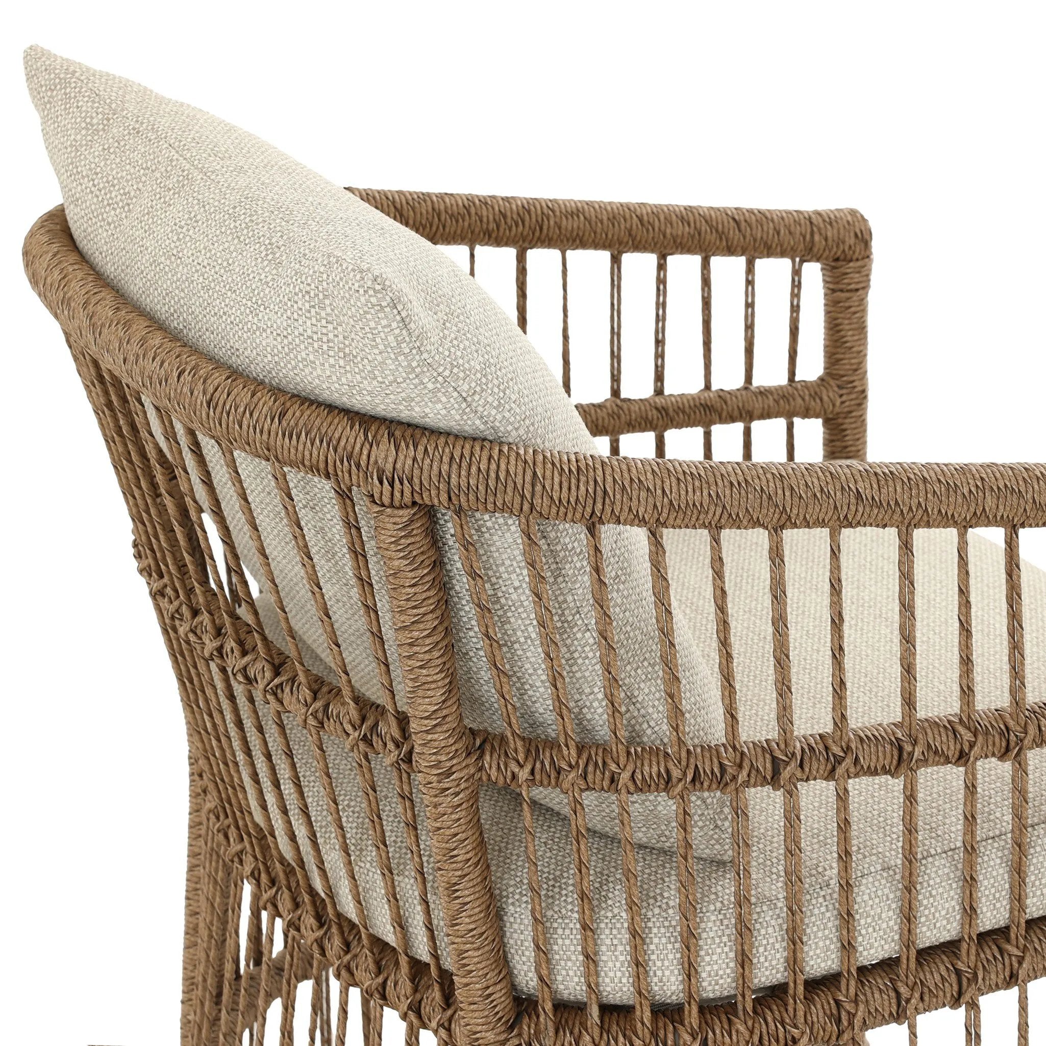 Cottage-inspired, faux hyacinth mimics its natural counterpart, with joint wrapping and texture for depth and character defining this outdoor dining chair. Varied proportion for dimension. Upholstered in a UV-resistant, water-repellent, quick-drying fabric. Cover or store indoors during inclement weather and when not in use Amethyst Home provides interior design, new home construction design consulting, vintage area rugs, and lighting in the Charlotte metro area.