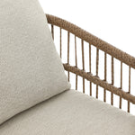 Cottage-inspired, faux hyacinth mimics its natural counterpart, with joint wrapping and texture for depth and character defining this outdoor dining chair. Varied proportion for dimension. Upholstered in a UV-resistant, water-repellent, quick-drying fabric. Cover or store indoors during inclement weather and when not in use Amethyst Home provides interior design, new home construction design consulting, vintage area rugs, and lighting in the Miami metro area.